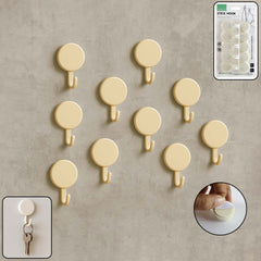 Set of 10 self adhesive round wall hooks on display