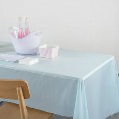 Clear rectangular plastic table cover laid out