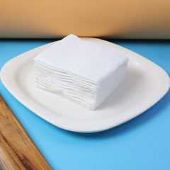 Soft tissue napkins with embossed texture