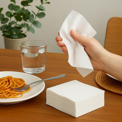 White disposable paper napkins on table