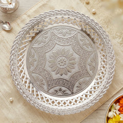 Traditional silver serving platter with embossed floral pattern