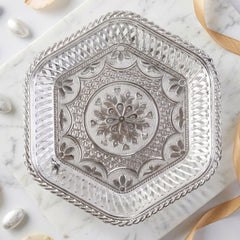 Beautiful silver tray with footed base and intricate floral embossing for serving and decoration
