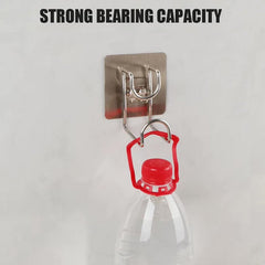 Transparent adhesive hook securely holding a kitchen towel