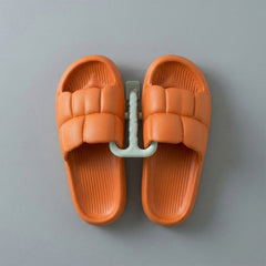 Wall mounted slipper holder in bathroom