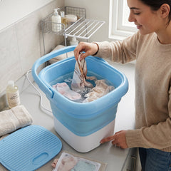 Mini washing machine washing clothes inside