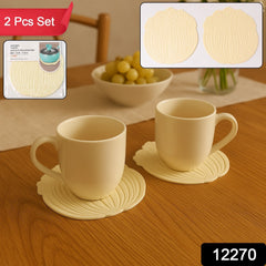 Two green silicone leaf coasters with a cup of tea