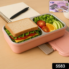 Lunch box showing separate compartments and secure lid