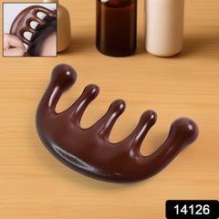 Manual head massage comb in use