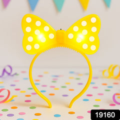 LED bow hairband worn by a child at a party