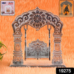 Ornamental swing showing Laddu Gopal in home mandir