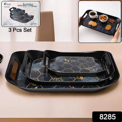 Three plastic serving trays stacked