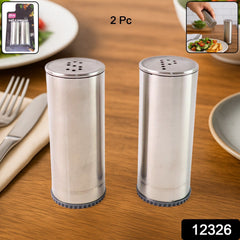 Classic stainless steel salt and pepper shakers on table