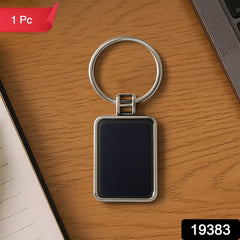 Black and silver rectangular keychain with metro stripe design