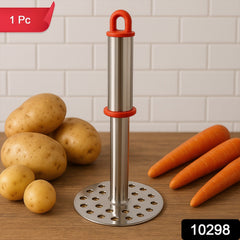 Potato masher mashing cooked potatoes in a bowl