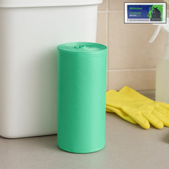 Close-up of biodegradable green garbage bag roll packaging.