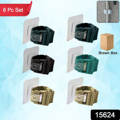 Close-up of self-adhesive holder clips gripping broom handles
