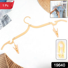 Clothes hanging on adjustable folding hanger