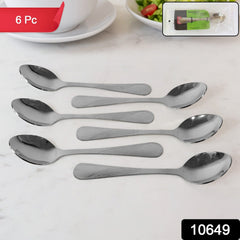 Set of stainless steel spoons on white background