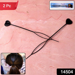 Close-up of heart-shaped hairpins in hair