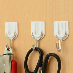White self-adhesive wall hook for towels and robes.