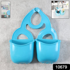 Twin baskets in sink organizer holding sponges and brushes