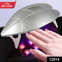 Hand with gel nails curing under the Mini UV LED nail lamp