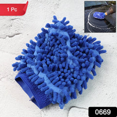 Hand wearing microfiber mitt washing a car