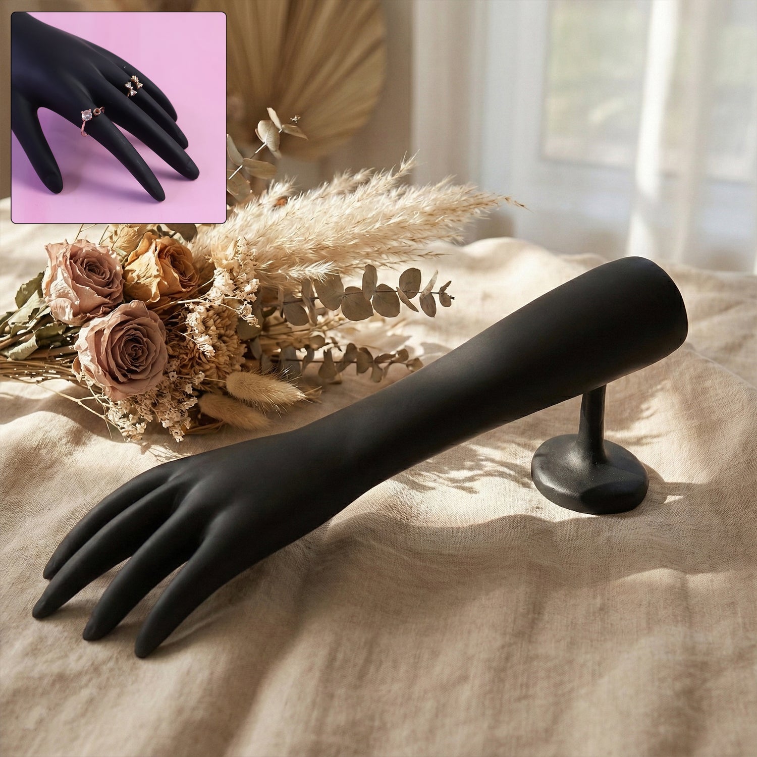 Black hand-shaped jewelry display stand front view