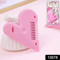 Pair of heart-handled hair scissors on a white background