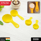 Hand using a plastic mould spoon to shape a perfect ladoo