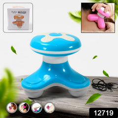 Triangle mini massager in hand showing compact size