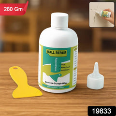 Applying wall repair cream to mend wall cracks