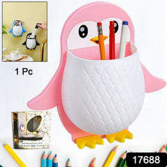 Side view of penguin wall organizer holding remote and toothbrush