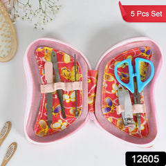 Close-up of sharp nail cutter and scissors in manicure set