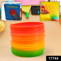 Child playing with Rainbow Slinky Spring Toy