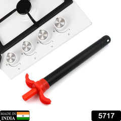 Close-up of stainless steel gas lighter igniting stove