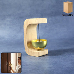 Zen meditation bell with wooden stand on white background