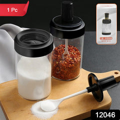 Glass spice jar display with wooden tray on kitchen counter