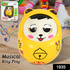 Baby interacting with a musical roly poly toy on a mat