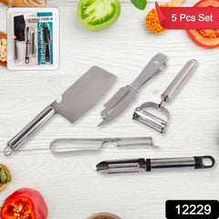 Hand demonstrating the julienne peeler on a carrot