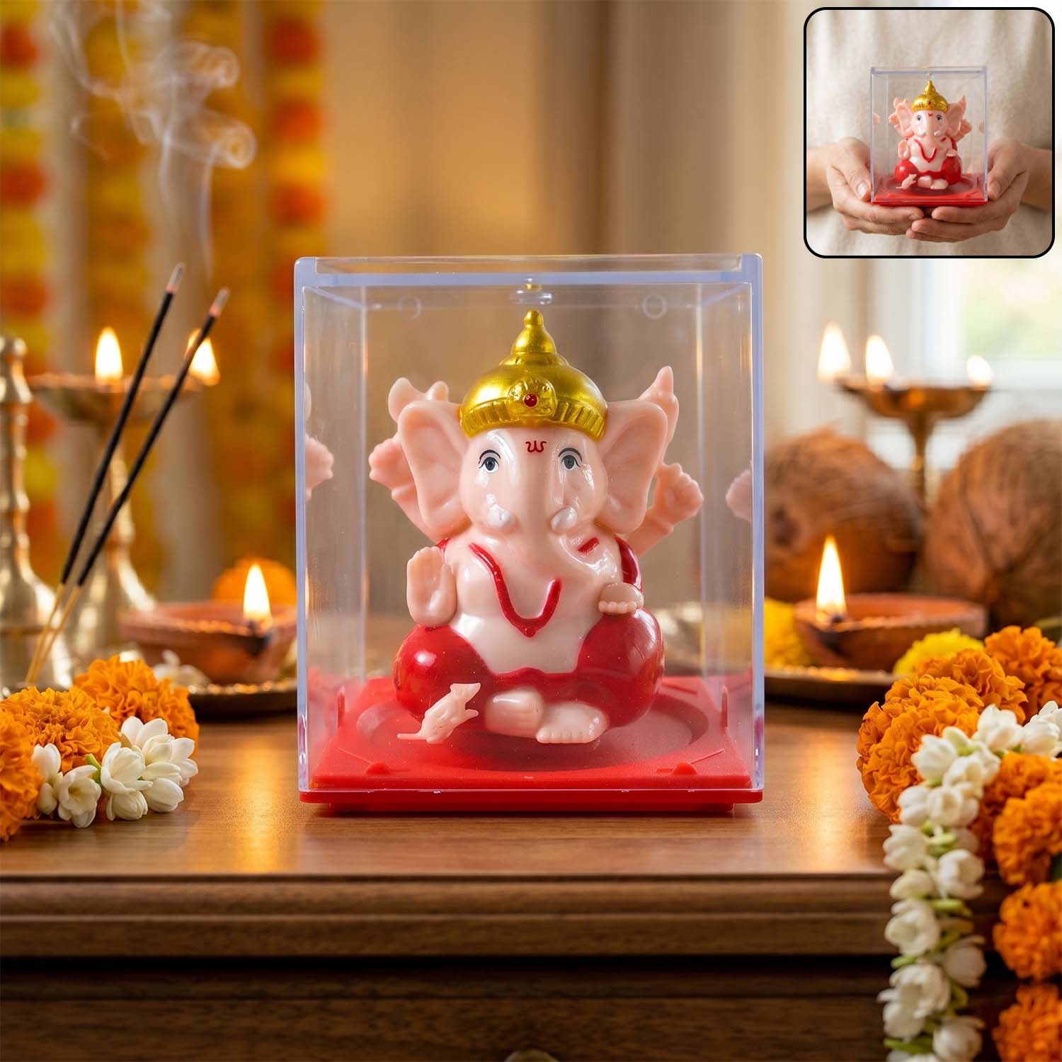 Hand-moving small red and gold Ganesha idol