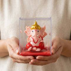 Front view of small Ganesha idol with rotating hands