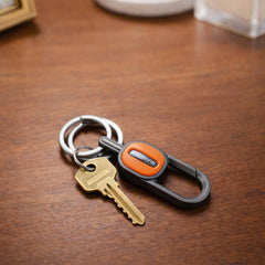 Push lock mechanism on the metal keychain for secure key attachment