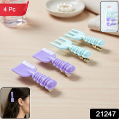 Close-up of hair clips showing fork and spade designs