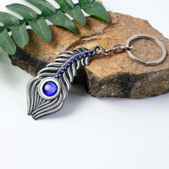 Close-up of peacock eye design on keychain