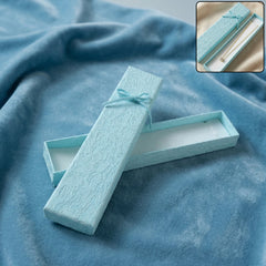 Premium long rectangular jewelry gift box closed with ribbon
