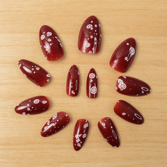 Artificial Burgundy Nails with Floral Patterns
