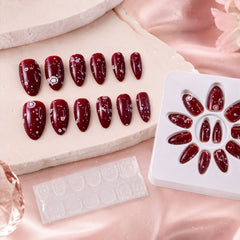 Close-up of a long coffin press-on false nail with intricate 3D embellishments