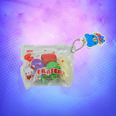 Close-up of mini fruit erasers (strawberry, banana) on a pencil