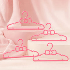 Children's wardrobe hangers with bow detail for small garments